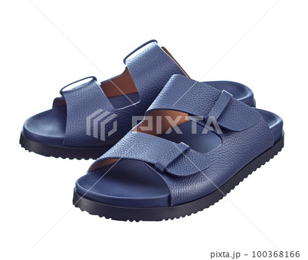 Beautiful pair of blue leather flip-flops with two straps isolated on a white background. Hit of the season. Beautiful pair of blue leather flip-flops with two straps isolated on a white background. Hit of the season. 100368166