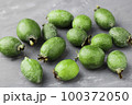 Green feijoa fruits on gray concrete background table. Tropical fruit feijoa. Set of ripe feijoa fruits. Copy space 100372050