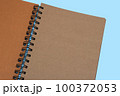 Notebook, with place for your image, text or corporate identity details. Spiral notepad on a table. 100372053