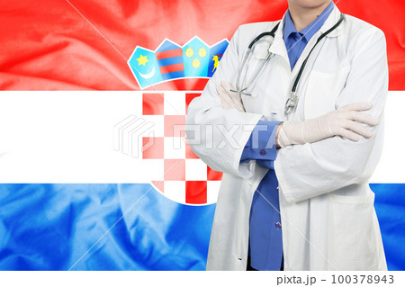 Doctor standing with the flag Doctor standing with the flag 100378943