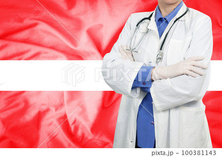 Doctor standing with the flag Doctor standing with the flag 100381143