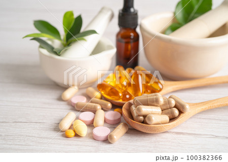 Alternative medicine herbal organic capsule with vitamin E omega 3 fish oil, mineral, drug with herbs leaf natural supplements for healthy good life. 100382366