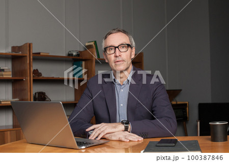 Mature grey haired businessman or entrepreneur Mature grey haired businessman or entrepreneur 100387846