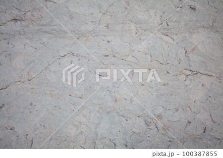 Light gray stone background, surface with cracks 100387855