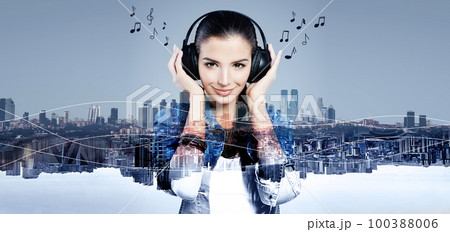 Young happy woman with headphones Young happy woman with headphones 100388006