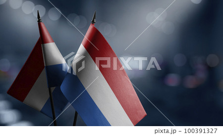 A small Netherlands flag on an abstract blurry background 100391327