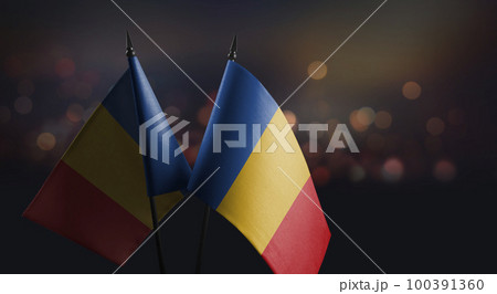 Small flags of the Chad on an abstract blurry background 100391360