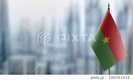 Small flags of the Burkina Faso on an abstract blurry background 100391838