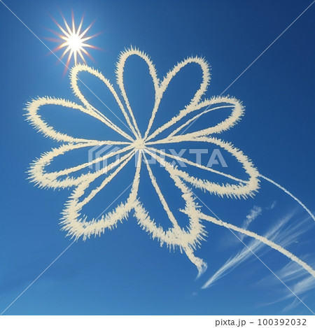Flower symbol sign drawn by white airplane trail on blue sky, close up, love, abstract creative background 100392032