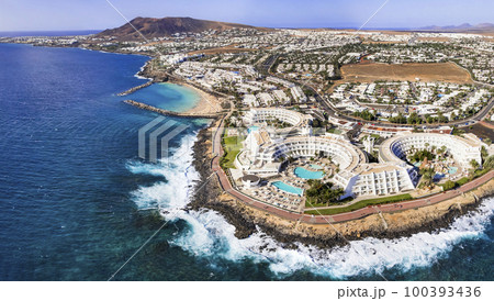Lanzarote island, Playa Blanca resort. aerial drone panoramic view. Canary islands of Spain Lanzarote island, Playa Blanca resort. aerial drone panoramic view. Canary islands of Spain 100393436