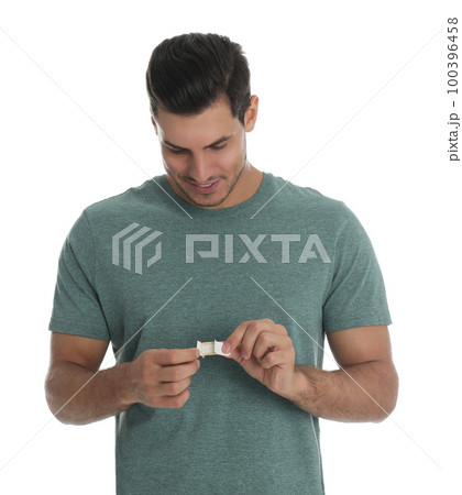 Happy man with sticking plaster on white background Happy man with sticking plaster on white background 100396458