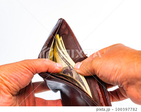 Hands count money American dollars in a men's wallet. 100397782