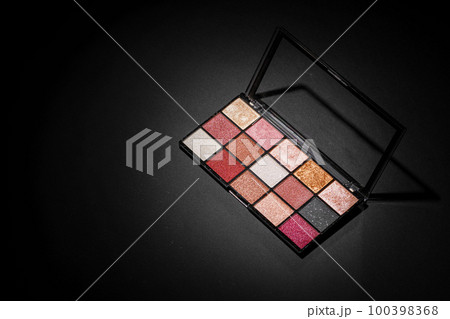 Color professional cosmetic palette on a dark background 100398368