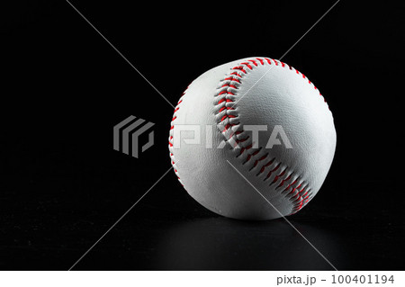 Baseball game equipment on dark black background Baseball game equipment on dark black background 100401194