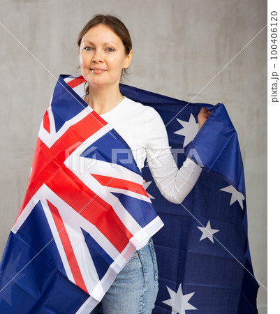 Portrait of positive young woman with flag of Australia 100406120