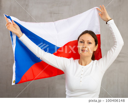 Adult cheerful woman holding Czech Republic flag 100406148