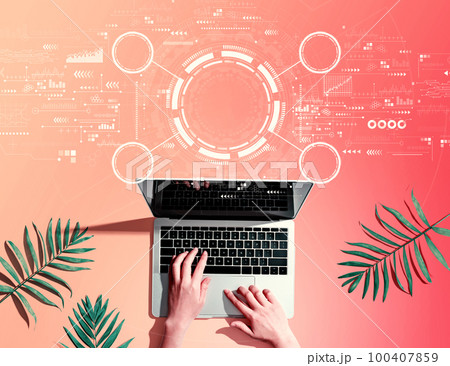 Tech circle with person using a laptop 100407859