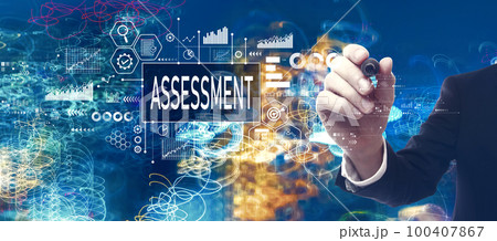 Assessment concept with businessman in a bokeh neon light trails city background 100407867