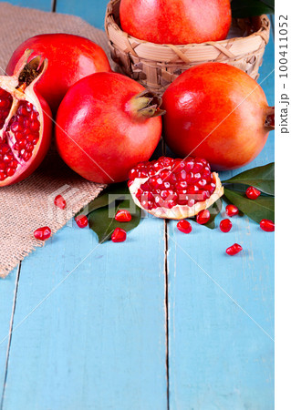 Ripe pomegranate fruits on the wooden background 100411052