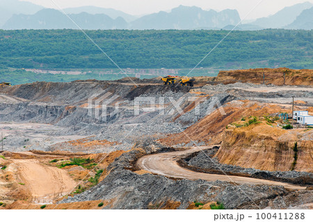 Part of a pit with big mining truck working Part of a pit with big mining truck working 100411288