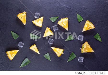 Fresh pineapple on black wood, black background. Fresh pineapple on black wood, black background. 100411619