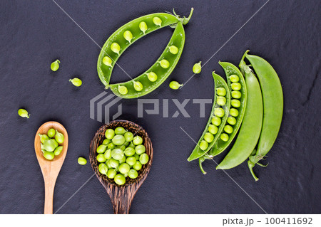 Sugar snap peas with mint on a rustic wood background 100411692