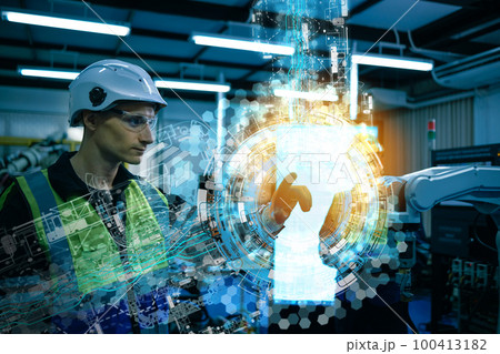 Multiracial technicial engineer training with robot arm Multiracial technicial engineer training with robot arm 100413182