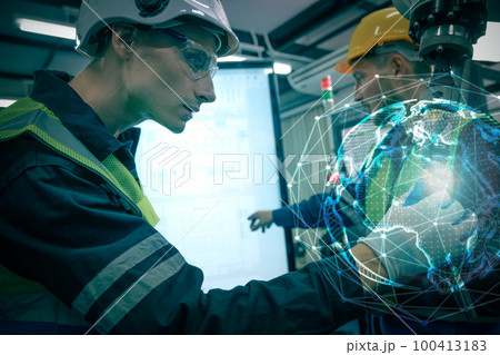 Multiracial technicial engineer training with robot arm Multiracial technicial engineer training with robot arm 100413183