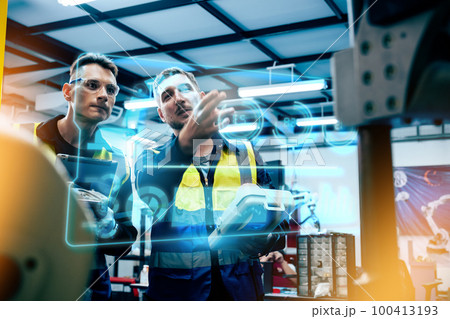 Multiracial technicial engineer training with robot arm 100413193