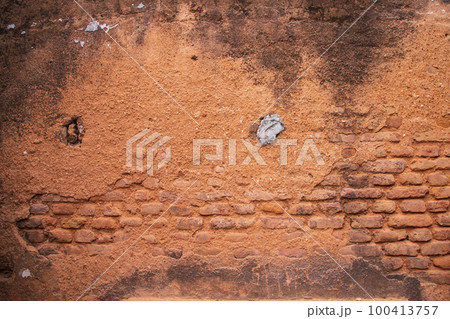 Old brick wall red plaster texture can be used as a background wallpaper Old brick wall red plaster texture can be used as a background wallpaper 100413757