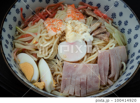 Cold noodles (Remen) with roast pork sliced, shrimp, ham and egg in lemon sauce. Cold noodles (Remen) with roast pork sliced, shrimp, ham and egg in lemon sauce. 100414920