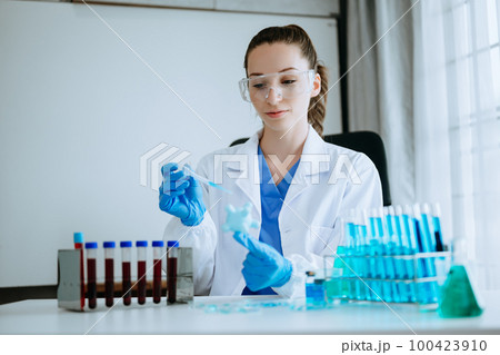 Coronavirus COVID-19 medical test vaccine research and development concept.in the chemistry lab. 100423910