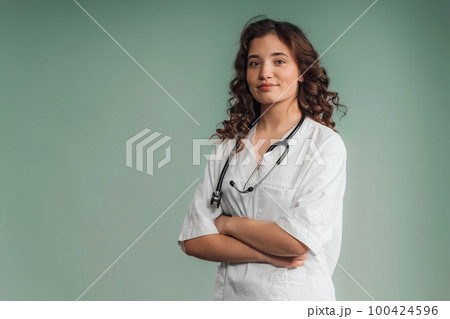 Portrait of young curly nurse, studio shoot. Portrait of young curly nurse, studio shoot. 100424596