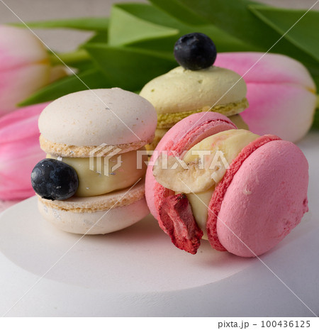 Baked macarons with different flavors on the table, dessert Baked macarons with different flavors on the table, dessert 100436125
