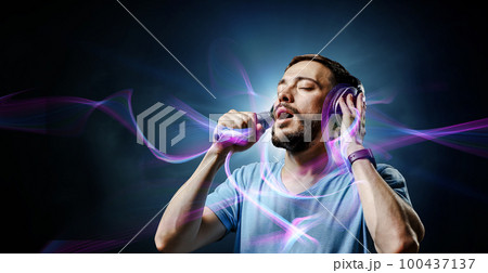 Young man with headphones . Mixed media 100437137