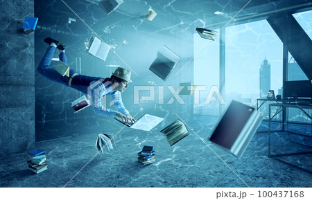 Man with laptop underwater . Mixed media 100437168