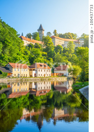 Jakobinka Tower - a remnant of the extinct Upper Rozmberk Castle. Morning view from the Vltava riverbank in Rozmberk nad Vltavou, Czech Republic Jakobinka Tower - a remnant of the extinct Upper Rozmberk Castle. Morning view from the Vltava riverbank in Rozmberk nad Vltavou, Czech Republic 100437733