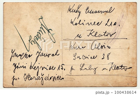 Back of a vintage photo - used postcard. Rich stain and paper details. Can be used as background. Postcard contains handwriting. Back of a vintage photo - used postcard. Rich stain and paper details. Can be used as background. Postcard contains handwriting. 100438614