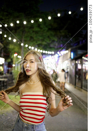 Girl in Night Market 100439773