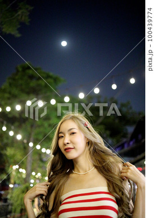 Girl in Night Market 100439774