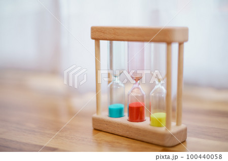 Colorful hourglasses with blurred background cute concept Colorful hourglasses with blurred background cute concept 100440058