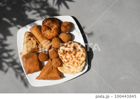 Sri Lankan different street food, vegetable and coconut roti, cutlets, snack. Sri Lankan different street food, vegetable and coconut roti, cutlets, snack. 100443845