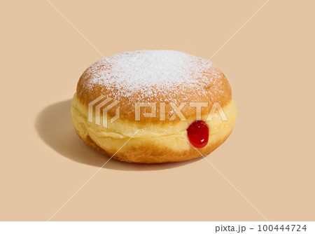 jelly donut on beige background 100444724