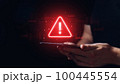 Caution concept. The person is holding a tablet with a sign. 100445554