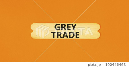 Grey trade symbol. Concept words Grey trade on wooden sticks. Beautiful orange table orange background. Business grey trade concept. Copy space. 100446468
