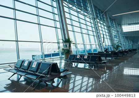 Interior of modern airport at daytime with no people inside it 100449813