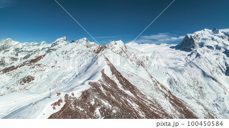 Beautiful Zermatt ski resort with view of the Matterhorn peak on the horizon. Beautiful Swiss Alps. 100450584