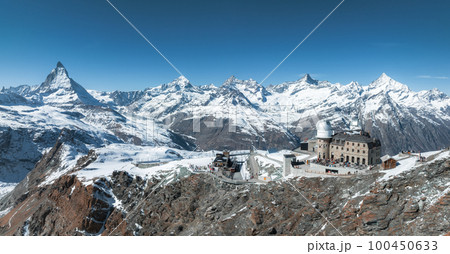 Aerial panorama view of the luxury hotel and the astronomic observatory at the Gornergrat, in the background of the Matterhorn or Cervino mount, Zermatt, Valais, Switzerland, Europe Aerial panorama view of the luxury hotel and the astronomic observatory at the Gornergrat, in the background of the Matterhorn or Cervino mount, Zermatt, Valais, Switzerland, Europe 100450633