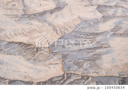 Selective focus close up of map detail of Mt. Everest topographical map showing contour lines, elevation. High quality photo Selective focus close up of map detail of Mt. Everest topographical map showing contour lines, elevation. High quality photo 100450634