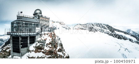 Aerial panorama view of the Sphinx Observatory on Jungfraujoch - Top of Europe, one of the highest observatories in the world located at the Jungfrau railway station, Bernese Oberland, Switzerland. Aerial panorama view of the Sphinx Observatory on Jungfraujoch - Top of Europe, one of the highest observatories in the world located at the Jungfrau railway station, Bernese Oberland, Switzerland. 100450971